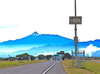 Driving along the Carretera to the beach. Colima Volcano is front and center.