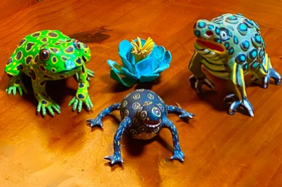 Clay and wooden frogs found in different places in Mexico